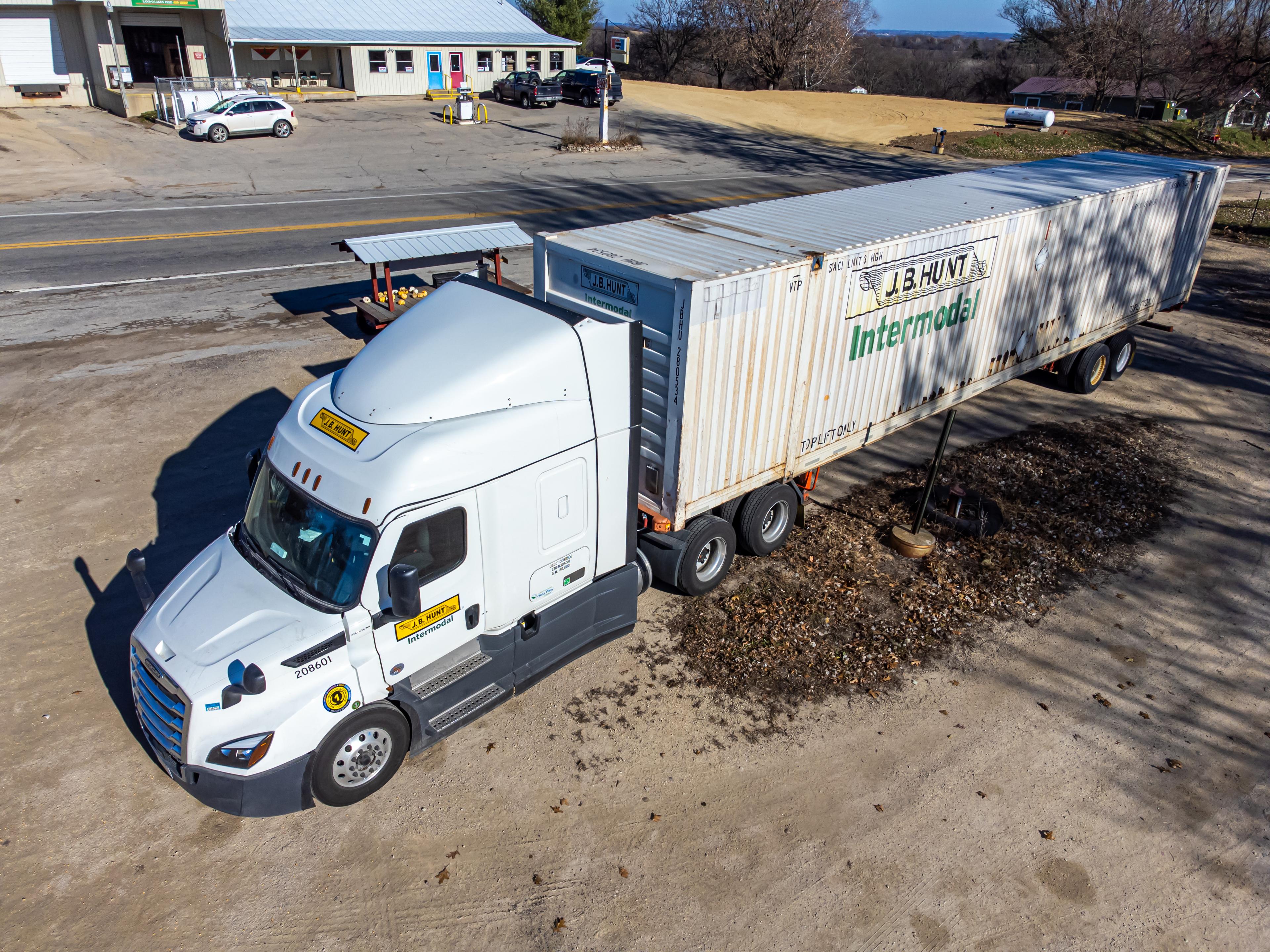 Commercial trucks on a highway at dusk — freight and logistics